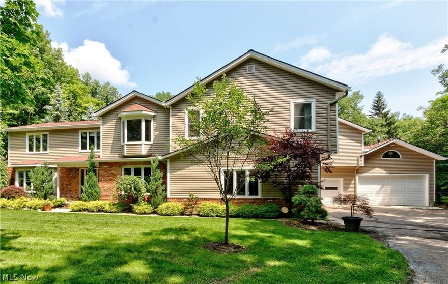 Welcome to your own private oasis! Tucked back a few hundred feet off the road sits this 4 BR/2.5BA, 5000+ Sq Ft Traditional Colonial which offers a unique 2nd-floor additional living space with 2BR/2BA & its own separate entrance - perfect for an extended guest or a family member looking for privacy. The main living area has an eat-in kitchen w/stainless steel appliances, granite countertops & breakfast bar that opens up to the family rm w/hardwood floors & WB stone fireplace. The 3-season sunroom w/gorgeous vaulted ceiling covered in knotty pine provides lots of natural light & breathtaking views of your pool & private backyard. Newly carpeted living room & dining rm & 1st-floor office complete the main level. Upstairs the large, vaulted ceiling Owner's bedroom offers an ensuite, spacious closet & a separate seating area. The additional 3 BR's are spacious & have large closets. The full, unfinished basement provides extra storage & is ready for your own personal touch. TWO...3-car garages, 1 with cathedral ceiling that can accommodate an RV or boat. Enjoy the in-ground pool w/stamped concrete patio, provides the perfect place for parties or to unwind.  Newer updates Furnace, A/C & Water Heater (2016), Newer siding (2015) Water Softener Expansion Tank (2017). Minutes from the desirable Kenston Schools, highways & Chagrin Falls. Needs some finishing touches to make this your dream home. The home was appraised at a much higher value.  Begin your story here!