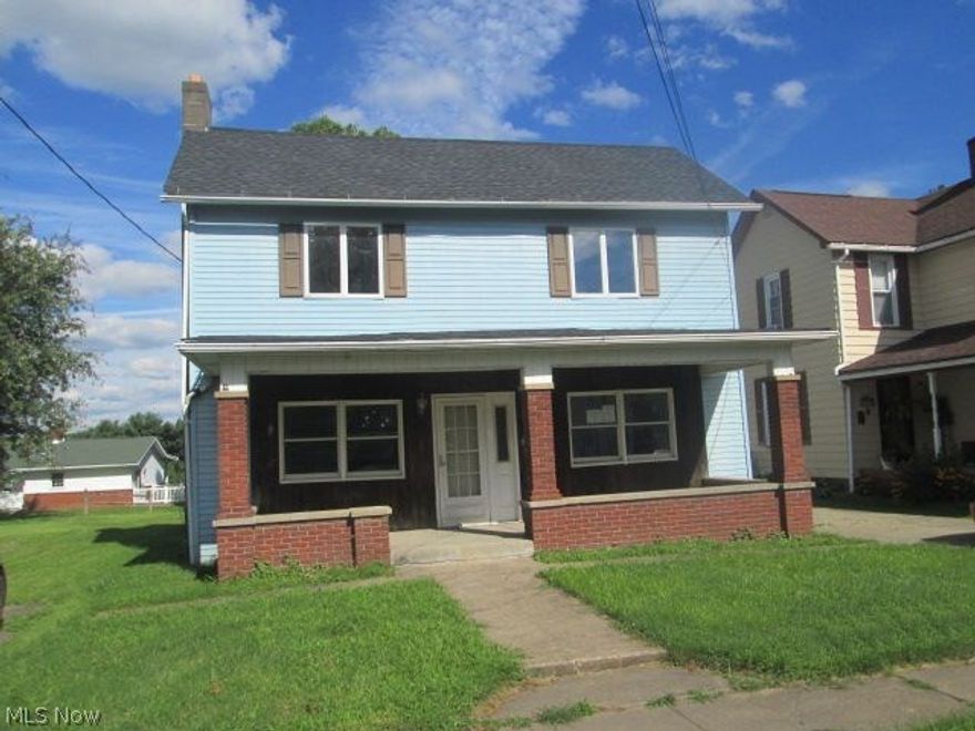 Large 2 story home with brick front porch and a 2 car detached garage. Home features a living room with working stone fireplace, dining room, kitchen, 4 bedrooms and 2 baths. 1 bedroom and 1 bath are on the first floor.