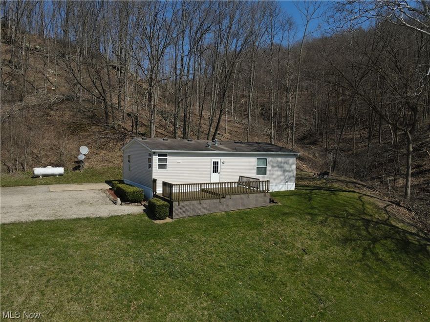 Here is a beautiful property that is ready to move in today! A nice home and a 55x30 shop sitting on 2 acres in a great location built in 2009. This property has been very well kept and cleaned up. As you enter the front door of the home you will find a nice spacious kitchen and living room, with 3 bedrooms and 2 bathrooms with propane heat on it as well. Also a very solid front porch with some great views. The shop was built in 2009 and is very spacious with electric in it as well. Quiet country living only minutes from Kimbolten. Added bonus with access to Wills creek across the street. Taxed as real estate. A great home or getaway for anyone!