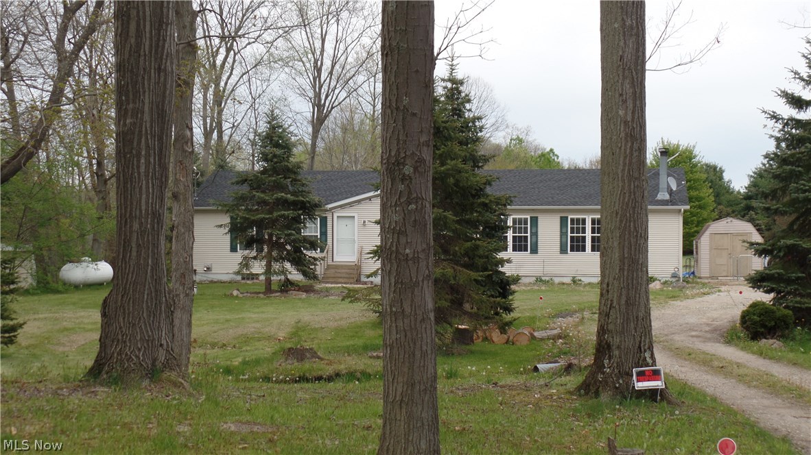 Just reduced! Huge manufactured home with a full, walk-out basement. Three bd/2ba, corner fireplace in LR. Huge deck, above ground pool, fenced yard, shed. Lots of room!!