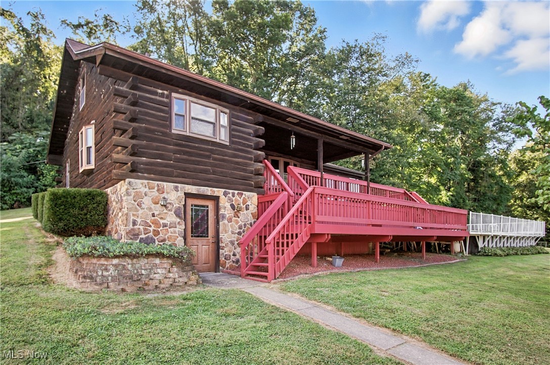This beautiful, one-owner, natural cut log cabin built in 1985, is nestled on 2.39 acres in Tri-Valley LSD. Great for commuters, this unique property offers both comfortable living and incredible business potential! The home features an above-ground Kayak pool with a beautiful multi-tiered wooden deck, replacement windows, an updated kitchen with quartz countertops, and a loft space perfect as an additional bedroom, office, or playroom. The inviting 4-season room provides extra living space and showcases the natural beauty of the outdoors. All appliances convey, including the washer & dryer.
What truly sets this property apart are the multiple outbuildings, with their own septic system, water well, and electric—separate from the house—making it small-business ready! Building 1, closest to St. Rt. 146, is a 40x40 insulated shop with 16' ceilings, a 14x14 door large enough for semis, a full bath, storage room above, and a 3-hour fire wall for added safety. The middle 24x45 two-car garage includes an enclosed lean-to, perfect for an office or parts room. The third building is 24x40 with a 14x14 door, ideal for semis or RVs, and even includes a pit for oil changes plus a side bay for additional vehicle access. All main buildings are equipped with an air system for compressors. A 15x16 shed rounds out the space—great for tractor, mower, or equipment storage.
This property truly offers endless possibilities, whether for hobbyists, car enthusiasts, mechanics or entrepreneurs looking for a business-ready setup, all while enjoying the warmth and character of a classic log home.