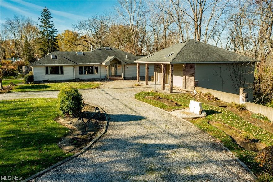 Very unique 4.5 acre property w/ river access at rear of property. Property includes two very nice brick front and block outbuildings. The first building is 40 x 30 and has a full basement underneath. The second building is 48 x 47. Both buildings have a picnic shelter overhead. Building closest to the house has water & heat. Both have electric. Both are extremely nice buildings w/ tons of usage ideas. House is a one story home w/ 3 bedrooms, 1 full bath, 2 half baths. 3rd bedroom is attached garage that could be used as a very nice in-law suite w/ a little work. Master bath is 22 x 16 and overlooks the wooded lot. Master bedroom also faces the rear of the home w/ large picture window overlooking woods - and could be river view w/ some tree clearing. Home has two separate basement areas. One is accessed from inside the home; second is accessed from the rear of home. Put your ideas to work on this beauty!