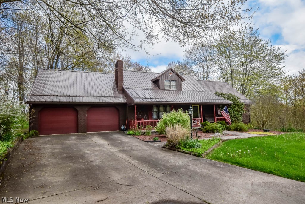 Tucked away on a serene cul de sac, this 3 bedroom cape cod boasts over 3500 square feet of living space and a spacious 1.56 acre lot! Set back from the road, it features charming curb appeal, a sturdy metal roof, and a welcoming front porch. Step inside to a foyer leading to the living room centered around a wood burning fireplace. The sizable eat-in kitchen provides ample storage and counter space, with views into the vaulted family room showcasing a beamed ceiling, a gas fireplace, and deck access. The main level also includes a master bedroom with a double closet and French doors leading to a private full bath with a double sink vanity, as well as a laundry room and guest bath. Upstairs, two additional bedrooms with generous closets share another full bath. Below, the finished walk-out lower level boasts a spacious rec room with high ceilings, full windows, and a convenient half bath. Complete with a two-car attached garage and an extra bay for outdoor gear, this home satisfies all your storage needs, complemented by a backup generator for added peace of mind. Don't miss out on this beauty in the sought-after Northview neighborhood, offering a tranquil country ambiance just minutes from town! Call today!
