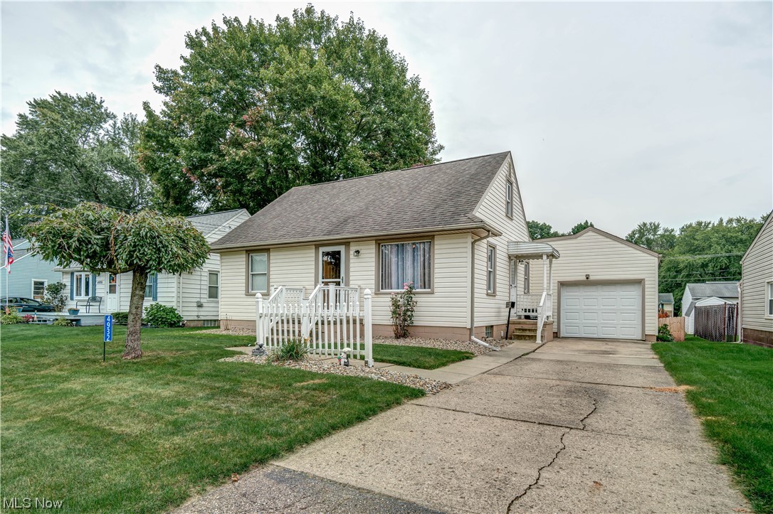 This delightful bungalow-style home in the Perry Schools is ready for its new owner. It features a cozy living room with a picture window overlooking the front yard, a kitchen connected to a spacious dining area with new luxury vinyl flooring, and a spacious fenced-in backyard that can be accessed from the sliding glass door. The main floor offers two bedrooms, one being the master bedroom with a built-in dresser system and an updated full bathroom with a walk-in shower. Upstairs, a vast third bedroom features two built-in beds and a half bathroom. The lower level offers storage, a bonus shower, and laundry facilities. Additional features include an attached 1.5-car garage, a high efficient furnace, fresh paint, and a new water softener. **Hardwood floors are believed to be under the carpet on the main level. Don't miss this opportunity – call now to schedule a showing and make this charming home your own!
