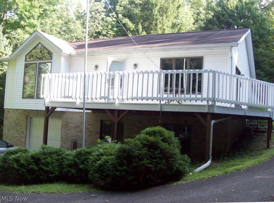 This peaceful and quiet property offering plenty of privacy is a must-see. Built in 1993, this one owner home is ideal for one floor living. The huge eat-=in kitchen is white and bright, offering tons of natural sunlight from the bay window and French doors that lead out to the wraparound deck. It has a Master Bedroom,  en suite full bath has oversized vanity for plenty of counter space. There is another full bath off hall that is handicap accessible with grip bars & walk-in stall shower.  Large laundry/utility room offers more convenience. There is TONS of closet and storage space throughout the main floor. The full basement is unfinished, but is framed and plumbed for additional bath so adding extra living space would be a breeze. There is oversized 1 car garage in basement and additional 2 car attached garage off the rear of the home. Situated on 1.86 acres with mature trees - this property has much to offer! Call today!