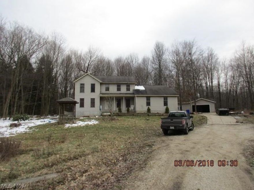 Large 2 story home on 6 acres with a private wooded setting.  3-4 bedrooms, 3 full & 1 half bath.  partially finished basement, 2 car attached and detached garages.