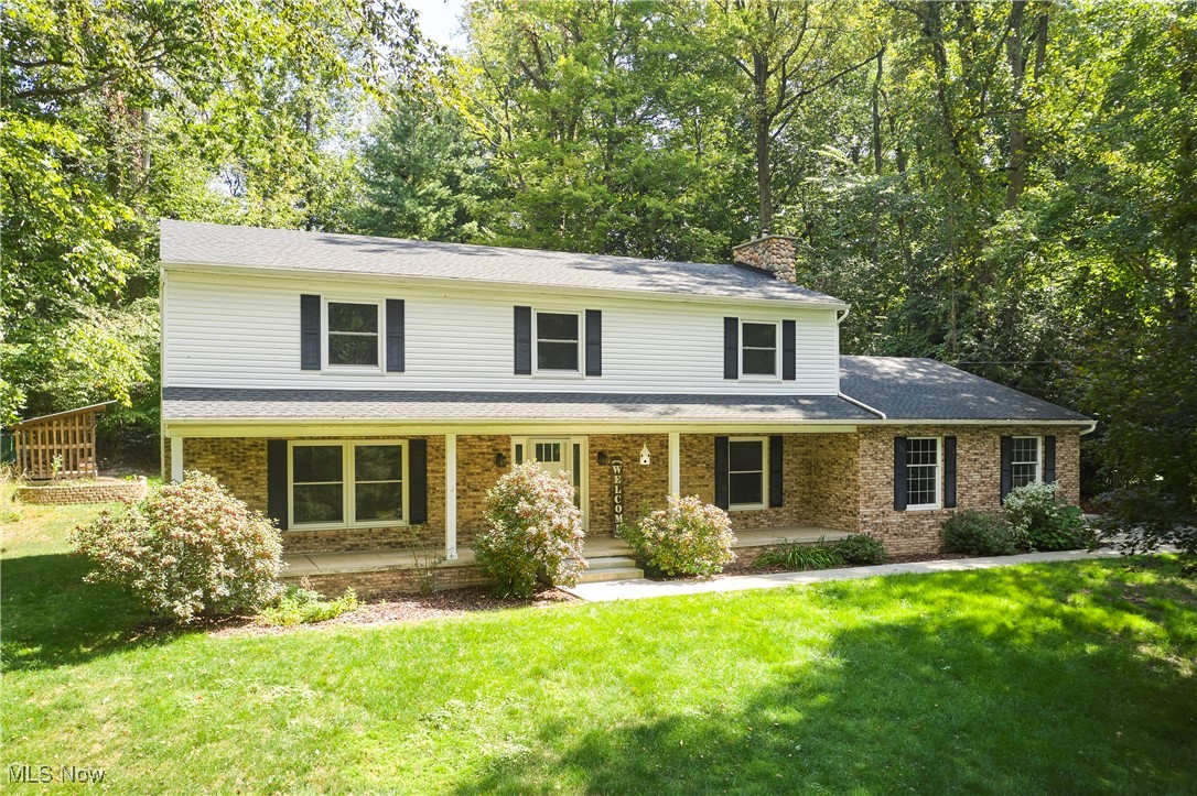 Tucked away on a quiet cul-de-sac in the Revere School District & situated on 1.5 acres is this stunning Colonial offering over 3400 sq ft w/$250k+ updates! The home combines modern improvements w/a layout designed to fit today’s lifestyles, from everyday living to entertaining - the list goes on. The main level features refinished hardwood floors, fresh paint, updated lighting, new windows, & an inviting front entry. Multiple gathering spaces include a bright family RM w/picture window & in-wall speakers, a formal dining RM w/wainscoting,& a cozy hearth room w/wood-burning FP. A drop zone, laundry, updated half BTH, & a flexible main-floor BDRM that works perfectly as a home office complete this area. At the heart of the home, the remodeled kitchen boasts maple cabinetry, a large center island, farmhouse sink, 36" gas range w/pot filler, double oven, & walk-in pantry. The adjoining dining space opens to a private patio surrounded by terraced gardens & mature trees—an ideal setting for summer dinners or quiet mornings w/coffee. A true highlight is the first-floor in-law suite w/its own private entrance, living room, kitchenette, spacious bedroom, ADA-compliant bath w/roll-in shower, direct garage access, & a walk-out to the backyard. It’s perfect for extended family, guests, or anyone who appreciates independence w/convenience. Upstairs the primary suite features refinished hardwoods, a renovated bath w/dual vanities, heated floors, & a walk-in closet. Three add'l bedrooms, an updated full bath, & plenty of storage round out the second floor. Recent improvements include: 200-amp electrical, radon system, HWT (2024), furnace (2021), A/C (2021), gutters (2020), & partial roof replacement (2020). With wooded privacy, flexible living spaces, and thoughtful updates throughout, this home is move-in ready and a wonderful place to call home.