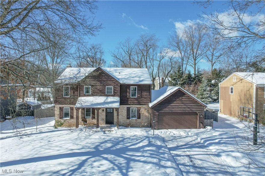 Welcome home to this beautifully updated 4-bedroom Colonial tucked away on a quiet cul-de-sac in the desirable Waltham Woods neighborhood of North Canton. This home offers fantastic curb appeal with its timeless brick and wood exterior and a freshly refreshed interior, professionally painted in December 2025. The main level features durable LVP flooring and a warm, inviting layout with a spacious living room, private dining room with wainscoting and modern lighting, and a convenient half bath.

The kitchen is a true showstopper—open and airy with a farmhouse-industrial feel, exposed beams, brick accent wall with live wood mantel over the range, center island with seating, pantry, and ample workspace—perfect for everyday living and entertaining. The adjacent family room continues the character with beamed ceilings and a cozy gas fireplace and opens to an enclosed sunroom overlooking the fully fenced backyard. Outside, enjoy summer days in the in-ground saltwater pool—your own private oasis!

Upstairs, you’ll find three generously sized bedrooms, that share a full bathroom. The primary suite with LVP flooring, walk-in closet, and private bath with separate vanity area. The lower level offers excellent potential with a partially finished area ready to be completed as a rec room, plus plenty of storage space and laundry. Additional highlights include an attached 2-car garage, basketball hoop, and prime location close to schools, parks, shopping, and dining. This one truly checks all the boxes—schedule your showing today!