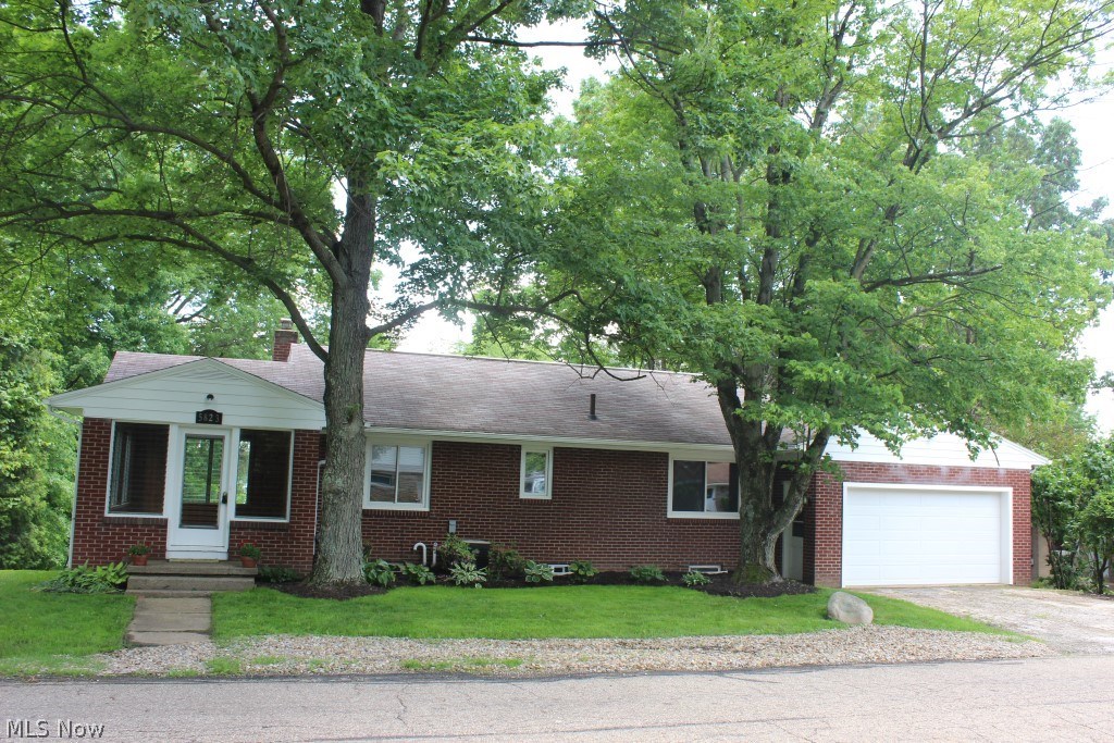 Delightful 3 bedroom, 2 bath updated brick ranch on Nimisila Reservoir with 1334SF including finished walkout on quite dead end street- an absolute best kept secret* Updates over the past 2 years including, but not limited too, kitchen with custom made maple cabinets, stainless appliances (range, refrig, microwave, dishwasher & disposal), bathroom with laundry chute, windows (except sun room), 95% eff furnace, central air, well pump & carpet (lower level)* Spacious 3 season sun room wrapped with windows & wood floors* Living room with over sized windows & wood floor* Eat in kitchen with laminate floor & slider to deck* 2 bedrooms & hallway with wood floor* Walk out rec room with wood burning fireplace with new carpet* 3rd bedroom with new carpet & overlooking back yard* Lower level bath* 2 car attached garage with opener & new door* Covered patio* 80 gallon hot water heater* Water conditioner* Media air cleaner* Outbuilding* Just move in!