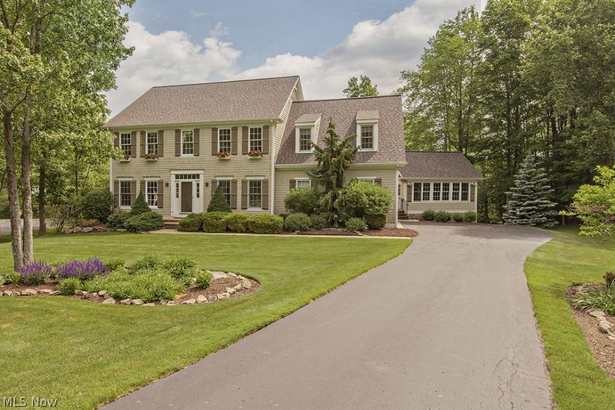 Highly sought-after home in the Laurel Springs community offering private swimming, tennis, playground, clubhouse and more. This home is move in ready! Brand new never been lived in carpet, new paint, new granite bathroom counters, newly painted basement and more make this home almost seem brand new!  Spacious kitchen which flows directly into the great room and sunroom!  Private bath in one of the bedrooms and jack & jill for the other two.  Wine cellar and bonus room make this home even sweeter!  Outside of the home - the wooded and private backyard is ready for entertaining; two tied upper deck, lower stone patio, full stone fireplace, built in grill with granite top, on a private cul-de-sac street! From inside the home to the exterior landscaping this home shows true pride of ownership