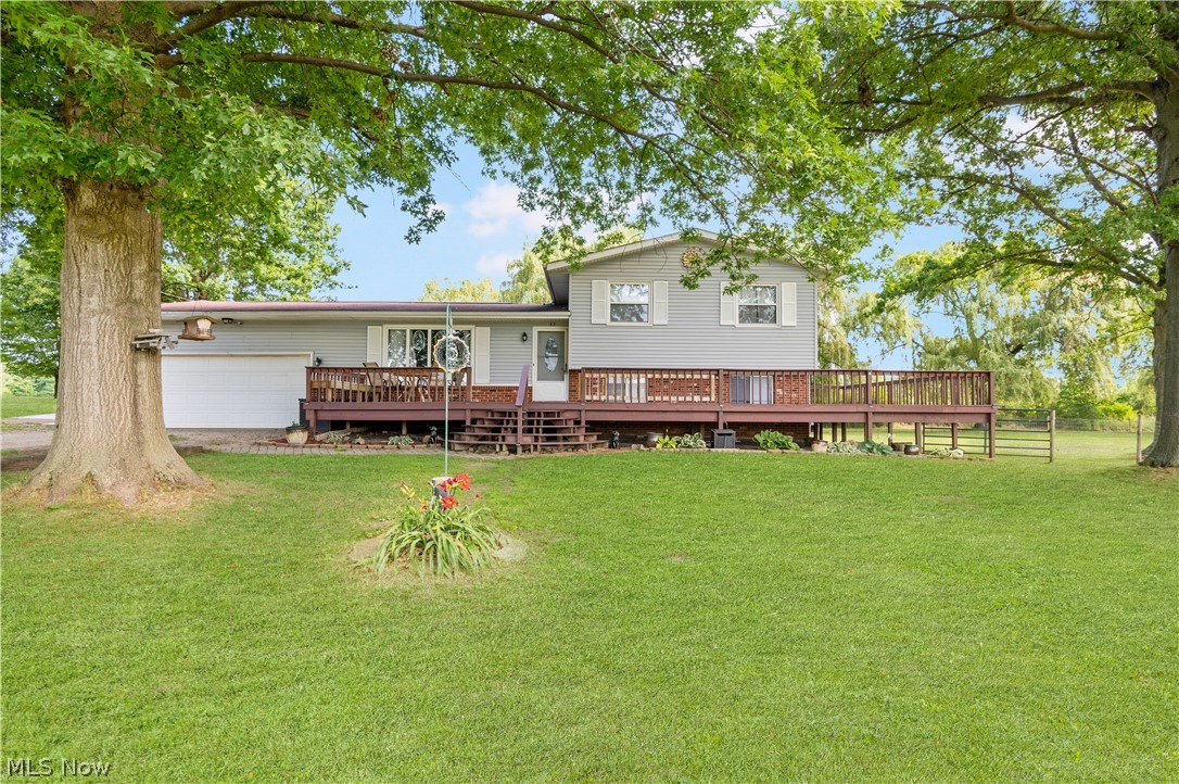 Located in Randolph township, sitting on a 1.65-acre lot, is this beautiful split-level home with an inviting 700 sq ft front porch. Welcomed by the great room that features a sleek electric fireplace and an abundance of natural light. The open concept great room leads to the dining area and kitchen. The spacious kitchen has an oversized island with cabinets galore, stainless steel appliances, updated hardwood floors, and a walkout to the large deck great for entertaining friends & family. The Lower level features a family room with a floor-to-ceiling Woodburner fireplace and a walkout to the patio perfect for enjoying the peaceful surroundings. The large private yard offers a pond, beautiful willow trees, a newly built shed, and a barn. The first bedroom with a convenient full bath around the corner, the partially finished basement, and access to the two-car garage off the family room. Upstairs offers three bright bedrooms with stunning bamboo hardwood floors and another full-size bat