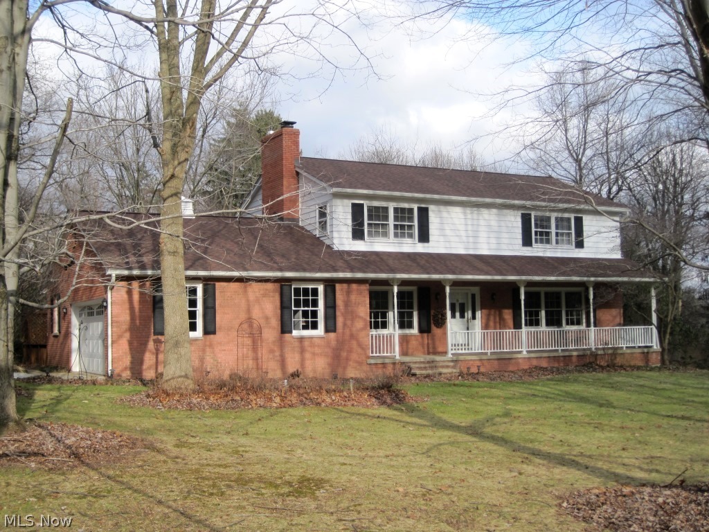 BATH TOWNSHIP: Peaceful setting for updated 4-5 bedroom, 3 bath, Beres built colonial within 1 mile of Rte. 77 Interchange; Revere schools. Bright and light living and family rooms each open to large gourmet kitchen with cherry cabinets. Exceptional treed lot provides privacy year round with mature pines, and open fields for kids. Views from every window. First floor den. Floor-to-ceiling, thermal pane windows enclose Florida room with walk out to deck. 1,130 sq. foot multi-level deck. Roof replaced in May with architectural shingles. Hardwood and ceramic floors, and crown molding throughout. Reverse osmosis water purification system. Newer, high energy efficient Trane furnace. Neighborhood lake association with pavilion for swimming, fishing, and parties. $75.00/annual HOA fee.