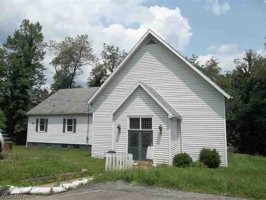 Fully furnished church, with 7 gorgeous stained glass windows. Main level houses church, offices, mulit-purpose rooms . Basement has 2 restrooms, kitchen and social hall, and storage room. Across street from Church is huge parking lot. Advise Survey.