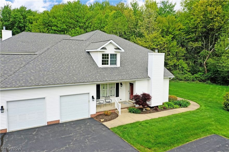 Meticulously curated with casual country feel, this gorgeous two-story Howland homestead is just the condo-style living that you’ve been looking for! Located just moments away from the area’s most desirable golf courses and attractions alike, this residence puts you in the heart of the action. Explore this darling corner unit that includes secure garage parking and secondary hallway entry. Meanwhile, a covered patio space joins the formal entrance, perfect for warm weather relaxation. Inside, the warm colors pair with natural colored carpet flooring as you take in the stunning views and welcoming sunlight from the towering, arch topped windows. A wood trimmed fireplace is found along the near wall as central dining takes full advantage of the sun. Towering ceilings extend over the open layout as the stairway climbs to find a gracious loft overlook. Past central dining, an immersive kitchen includes its own casual corner for daily meals, offsetting the dark stained cabinetry. Around the corner, a closet lined hall finds a half bath before opening to the first-floor master bedroom suite. Revel in the full private bath and bonus walk-in closet that completes the floor. Upstairs, a second full bath offsets the loft while an oversized guest bedroom enjoys its illustrious nook, a perfect office space or lounge. Downstairs, a full basement yields plenty of storage and laundry services. Laundry may also be located in the designated closet on the first floor.