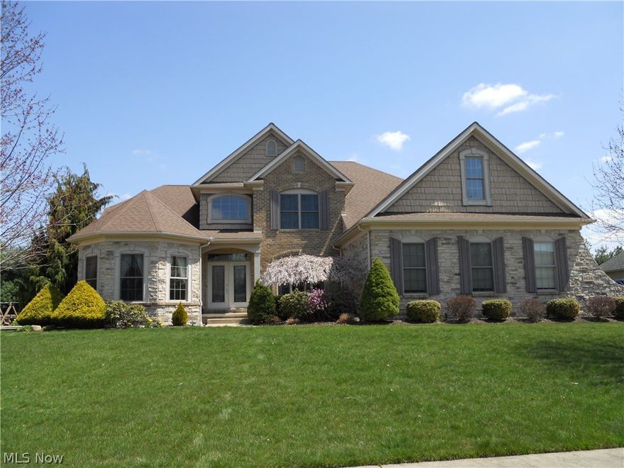 Spectacular mint condition home in the North Canton School system. Incredible fully applianced kitchen with maple cabinetry, tile backsplash, granite counter tops and serving island. Impressive wood floored foyer leading to 2-story great room with pillared archway. 1st floor master suite with coiffured ceiling and elegant bath. Bedroom 2 has its own bath and bedroom 3 & 4  share a bath. Finished lower level with pool table included, media area, exercise room, craft area, full bath and stairs leading directly to garage. What more could you want?