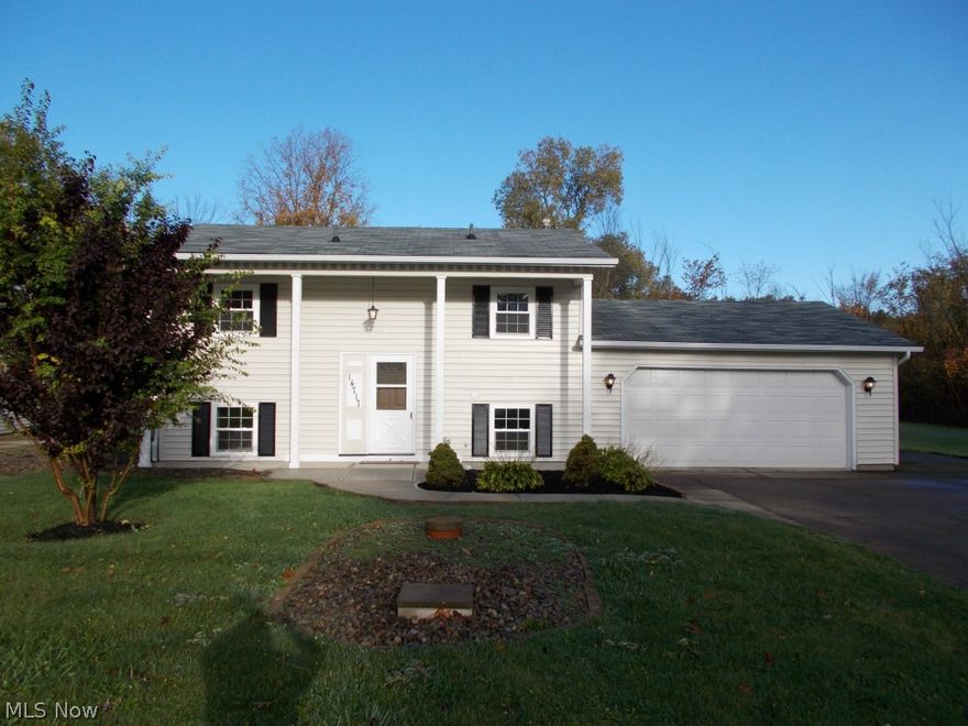 Great home on the outskirts of Vermilion.  This spacious bi-level home is situated on over .5 acres in Vermilion Township.  This home features a large master bedroom, 1 1/2 baths, hardwood floors on the upper level, and large open lower level.  The large garage, tool shed in the back yard, bonus room in the lower level, and larger closets offer plenty of storage space.  This home has been all redone and is waiting for its new owner to move in!