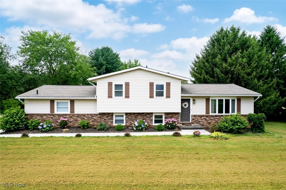 Welcome to this beautifully updated home nestled in a quiet country neighborhood. PRICED UNDER MARKET VALUE - seller found home of choice closer to job/family. This home features an open concept eat-in kitchen and living room. The fully applianced kitchen that was remodeled in 2022 boasts a huge quartz island and has 2 beautiful bay windows and gets lots of natural light. Upstairs, there are 3 bedrooms and a large bathroom with double sinks and quartz countertop. The lower level contains a beautiful mudroom area and also a cozy area for additional living space. The back doors were replaced in 2023 and lead outside to a large patio that is also attached to the deck. The bottom level also contains an office with built-in desk and a beautiful half bath. The other wing of the house has a large primary bedroom and en-suite with walk-in closet. This gorgeous bedroom features an electric fireplace and a mini-split ac unit was also added in 2022 to this side of the house. The en-suite bathroom has a large soaking tub and double sinks with quartz countertop. The primary bedroom has doors leading right to the deck. It truly is such a private beautiful oasis! The basement is unfinished and has hook-up for washer and dryer. This property has a huge private backyard and large 750 square foot detached garage with a loft and 220 amp service. This location has close access to Highway 21. Don’t miss out on this beautiful property that has many updates including a newer roof in 2022!