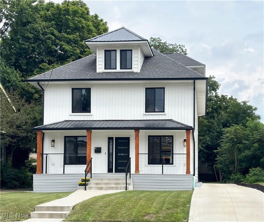 Welcome to your dream home in the heart of Highland Square, where modern luxury meets timeless charm. This completely renovated 4-bedroom, 2.5 bathroom Colonial offers high-end finishes and thoughtful details throughout.

The striking curb appeal begins with crisp white board and batten siding, contrasted by sleek black windows and gutters, and continues with a newly constructed driveway, garage, carport, a brand-new wood privacy fence and private deck—perfect for entertaining or unwinding outdoors.

Step inside to discover new light LVT flooring flowing throughout the home, creating a bright, cohesive, and low-maintenance foundation for your lifestyle. The open-concept main floor includes a bold black contemporary kitchen with a large center island, stainless steel appliances, and a sleek designer stainless hanging hood. 

 The adjoining wine bar with a wet bar and wine fridge creates the perfect space to host family and friends.
The living room invites relaxation with a full-wall electric fireplace, creating a cozy yet stylish focal point. 
 Upstairs, the primary suite impresses with a full-wall custom closet and a spa-inspired en suite bath featuring cathedral ceilings, a dual-head walk-in shower, and a luxurious soaking tub—your personal retreat. 2 additional bedrooms and a fully renovated bath with custom tiled shower complete the second floor. 4th bedroom is located on the 3rd floor.

Located just minutes from Mustard Seed Market, Portage Country Club, and Stan Hywet Hall & Gardens, this home is perfectly situated in one of Akron’s most up-and-coming neighborhoods—known for its unique charm, walkability, and growing community vibe.

 All major features have been updated offering peace of mind and turn-key convenience. Roof, furnace, central air new in 2022, water tank from 2018. Don’t miss this rare opportunity to own this dream home—schedule your private tour today!