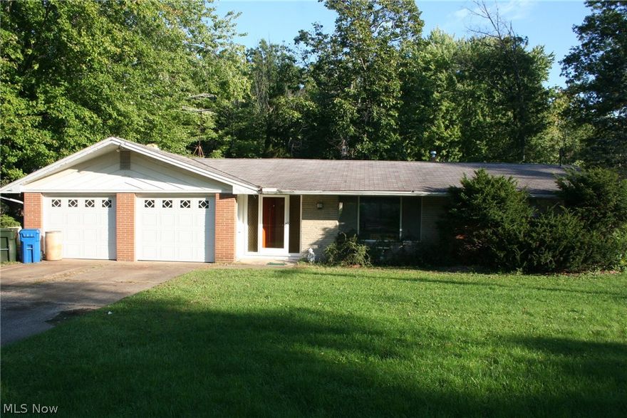 This diamond in the rough is a 2300 square foot ranch on over half an acre. A four bedroom, two full bath, two car garage and a basement ready for you to restore to its formal glory. The living room is accented with a brink wood burning fireplace, the great room with vaulted beamed ceiling, a large picture window in the front and four panel panoramic window to the rear facing the covered patio. On one end of the home is the master suite and on the other opposite end more bedrooms. The lot is wooded with a shed on a cul de sac. Call today!