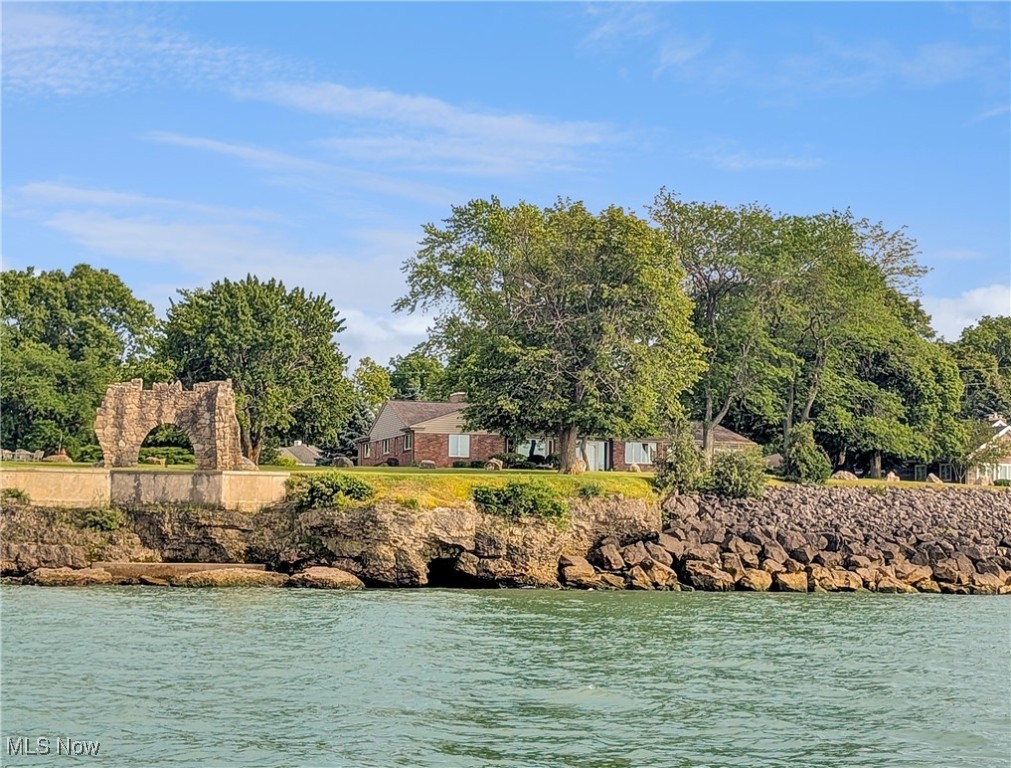 Nestled in the prestigious enclave of Catawba Cliffs and perched above the shimmering waters of Lake Erie, this exceptional residence offers breathtaking panoramic views of the lake and its idyllic islands. Set on .64 acres, this 3-bedroom, 3-bathroom home is a perfect blend of solid craftsmanship and timeless design.
Experience spectacular sunsets from the comfort of your living room, where expansive windows frame nature's nightly masterpiece. The thoughtfully designed kitchen features floor-to-ceiling cabinetry for maximum storage, oversized drawers for cookware, a built-in spice drawer, and custom compartments for cutting boards and bakeware, delivering both form and function for the home chef.
Additional highlights include a dedicated office space, generous storage throughout, and the enduring quality of well-constructed architecture, making it ideal for both year-round living and a luxurious seasonal retreat.