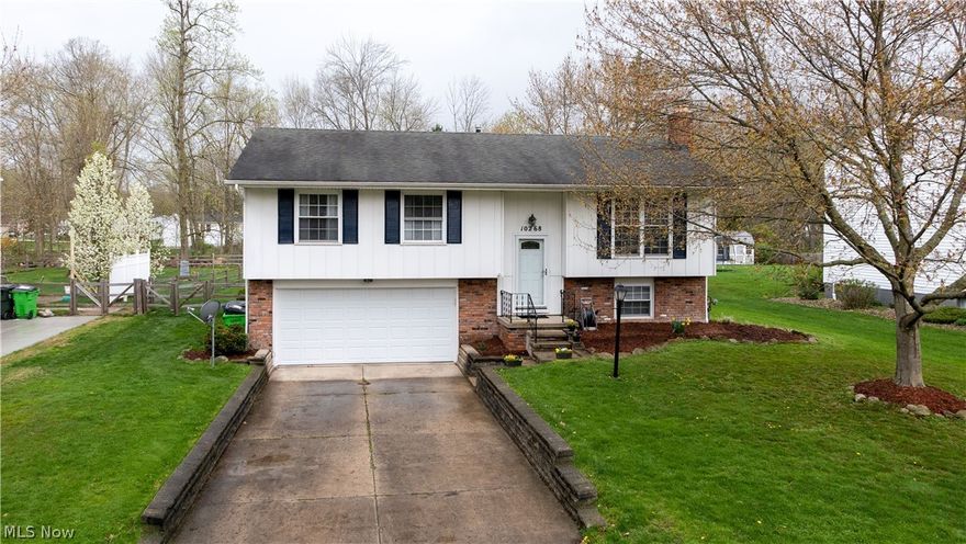 There are so many things to love about this 3 bedroom/2 bath home in the desirable Aurora Shores Community! The kitchen was completely updated in 2020 with quartz countertops, refinished cabinets, Luxury Vinyl Tile flooring, and a subway tile backsplash. The full bath was remodeled in 2020 with a new double vanity, tile flooring, a new tub/tiled shower, and paint. The half bath was also remodeled in 2019. There is new carpet, flooring and paint throughout. There is a bonus room with a wood burning fireplace that could be used as a den, office, or living room. The lower level is mostly finished and has an additional wood burning fireplace and even has a heated area for additional storage. As if this wasn't enough, you will enjoy entertaining in the backyard on the poured patio or in the fenced-in yard. The A/C was replaced in 2016 along with the hot water tank. This home has much to offer and even more updates than listed. A home warranty is also being provided! As a member of the Auror