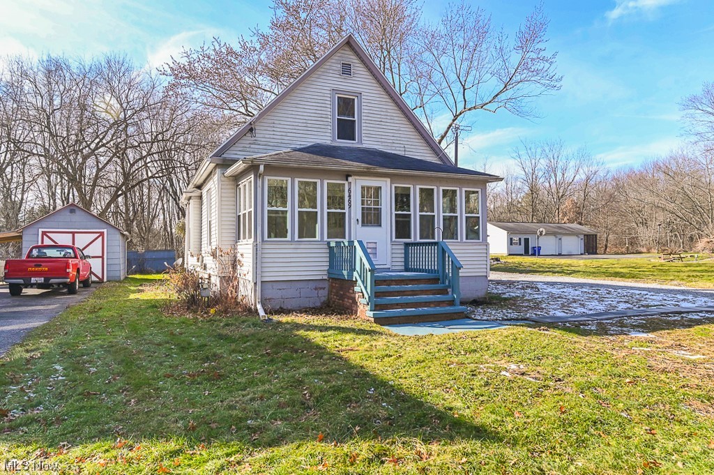 6469 Red Brush Road -- located in Ravenna Township. 3 bedrooms, 1 bath situated on .40 acres! Front enclosed porch/mudroom with so much natural light. Living area + separate dining area. Roomy kitchen area which leads to a beautifully rebuilt back deck. The home features First floor laundry and there are 2 bedrooms are on the first floor with an additional large master bedroom located on the upper level. There's an extra area that could be used as a 4th bedroom, office, play are, etc -- You decide. The oversized one car garage comes with a large carport. New windows, carpet, paint, hot water tank, furnace, newer A/C. The garage has a new roof, and garage door. The septic tank was recently cleaned out, and the house comes with city water. The basement has also been waterproofed and the foundation reinforced. There is nothing to do, just move right in. Come and take a look at this home today!!