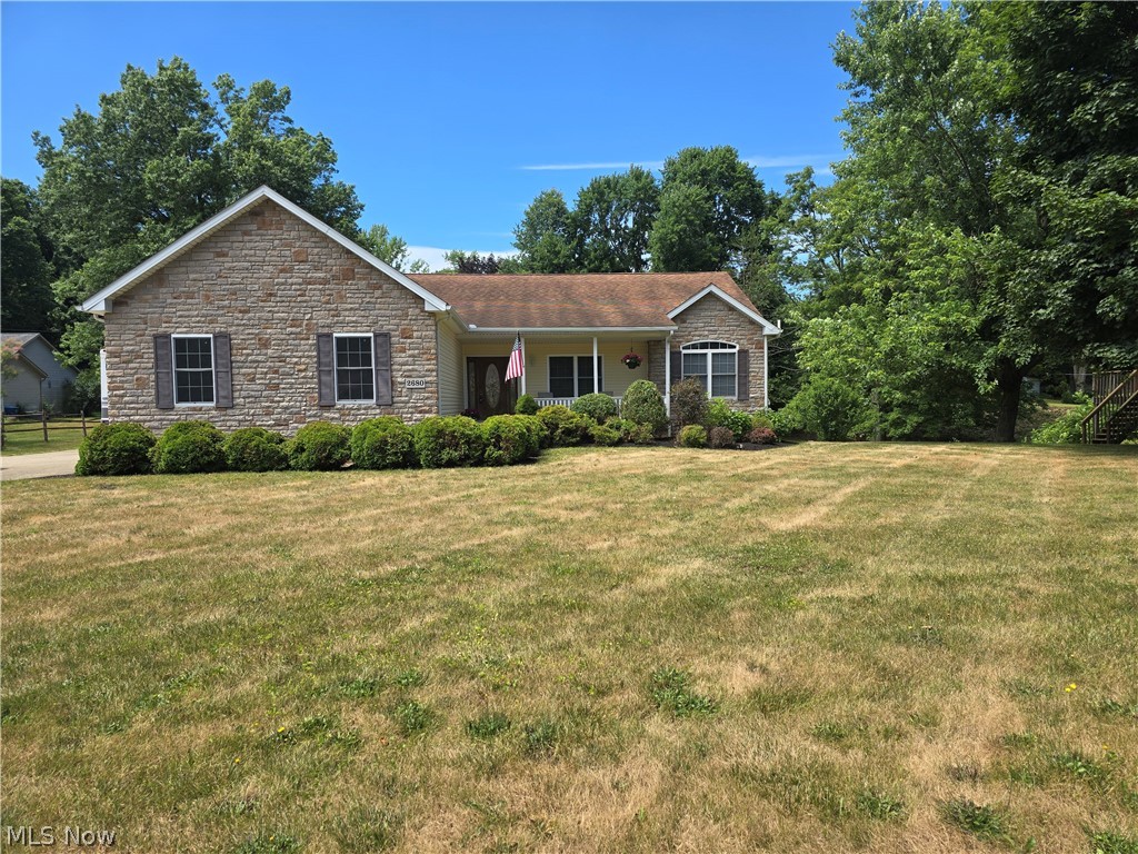 This lovely 4 bedroom ranch on a 3/4 + acre lot is first floor living at its best. The home features an open floor plan with generously sized rooms bathed in natural light. The walkout basement complete with bar, additional kitchen, recreation room, full bath and additional bedroom makes the perfect space for entertaining or a living space for adult family members. The two car attached garage and the additional 4 car garage is a car buff's dream. Freshly painted rooms and several rooms of new carpeting makes this home move in ready. Recent updates include new water softener and dishwasher in main level kitchen.