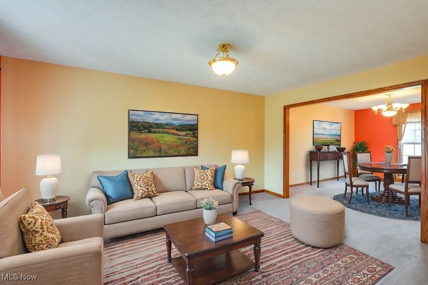 Located in the highly desirable River Bend community of Kent, this spacious 6BD/3.5BA residence offers an abundance of living space for a variety of living arrangements. At the entrance is a clever vestibule designed to help protect the home from the elements. The main level features a den/bonus room (that could double as a 7th bedroom), a convenient 1/2 bath, and an open living/dining room perfect for entertaining. The updated eat-in kitchen includes granite counters, pull-out cabinets, a pantry, stainless appliances and ceramic floors that extend through the laundry/mudroom to the attached 2-car garage. Adjacent to the kitchen is a cozy sunroom, featuring a skylight, views of the backyard, and easy access to the deck. The family room, with its inviting gas fireplace, provides a perfect gathering spot. Upstairs, the master suite offers a retreat featuring vaulted ceilings, walk-in closet, and bath with dual sink vanity and walk-in shower. 3 additional bedrooms on this level each offer generous closet space (two w/walk-in closets), and a guest bathroom. Almost 100% finished, the walk-out basement is a standout feature designed for versatility. It includes a large recreation room, 2 additional bedrooms, and a fully equipped kitchen with appliances—perfect for an in-law suite or independent living space. Outdoor enthusiasts will appreciate the large .6 acre backyard with raised gardens and easy access to River Bend Park, ideal to launch a kayak or canoe into the Cuyahoga River. Additional updates include a roof (2023) and a H2O heater (2018). This exceptional one-owner home is conveniently located less than a mile from Theodore Roosevelt High and Stanton Middle Schools and just minutes from downtown Kent, Route 43, and the Ohio Turnpike. With its spacious layout, thoughtful updates, and unparalleled location, this home offers a rare opportunity to enjoy both privacy and easy access to local amenities. Make an appointment with your favorite realtor today!