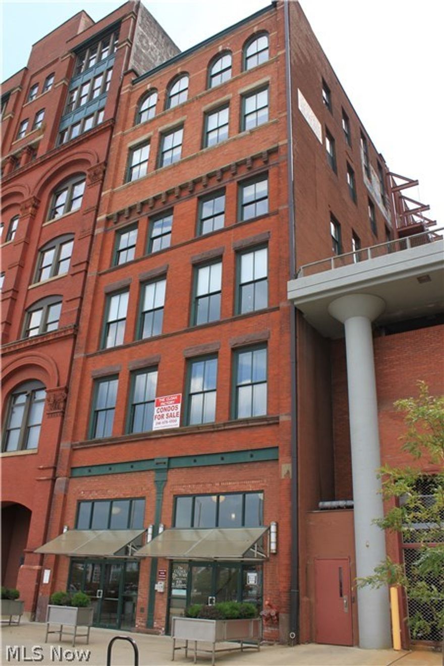 Welcome to this wonderful condo in the Historic Cloak Factory building. Warm hardwood floors, 14 ft ceilings, neutral colors, exposed brick &  windows enhance  the the open loft floorplan. Huge kitchen with beautiful cabinetry, granite counters & all stainless appliances included. The eating area is open to the Living room w/ a direct vent fireplace. The Master suite has a large closet, a spacious bath w/ granite counters, tub shower & linen closet.  The 2ndbedroom has  a large closet & access to main bath, which  appointed with granite counters & a tub shower. There is also a laundry area with washer , dryer & utility sink. Residents have 24 hr access to a full health club, a dog park, covered parking, and a fabulous view of the lake & Stadium from the landscaped roof top patio. This unit has extra secure storage on site.  All the city has to offer is just steps away including the grocery store! Come home to solitude amidst the city bustle, save time & gas. Tax abatement continued.