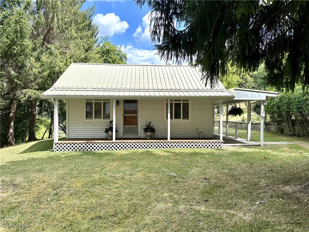 Country Living on 5 Acres – 3 BR Ranch with Barn & Garages! Escape to the peaceful countryside with this well-maintained 3 bedroom, 1.5 bath ranch home nestled on a scenic 5-acre hillside. Offering plenty of space inside & out, this property is perfect for those seeking privacy, room to roam, with hobby farm or homestead potential. The home features 3 spacious bedrooms with one having private access to the brand-new rear deck. The living room & dining room generous sizes give you the space you need to entertain along with the sparkling clean basement rec room area & abundant storage rooms. This warm, inviting ranch offers a flowing layout with great natural light throughout the home. The property highlights two detached garages – one with a workshop area, a barn with fenced pasture – ideal for animals or storage & a private, open yard with fenced-in garden for homesteading or hobbies. With plenty of space to relax, entertain, or expand, this 5-acre lot just outside of the city of Weirton offers endless possibilities. Enjoy the peace and quiet of country living while having all the modern comforts you need. With versatile outbuildings, a large yard, and a move-in ready home, this property checks all the boxes for a dream countryside retreat.