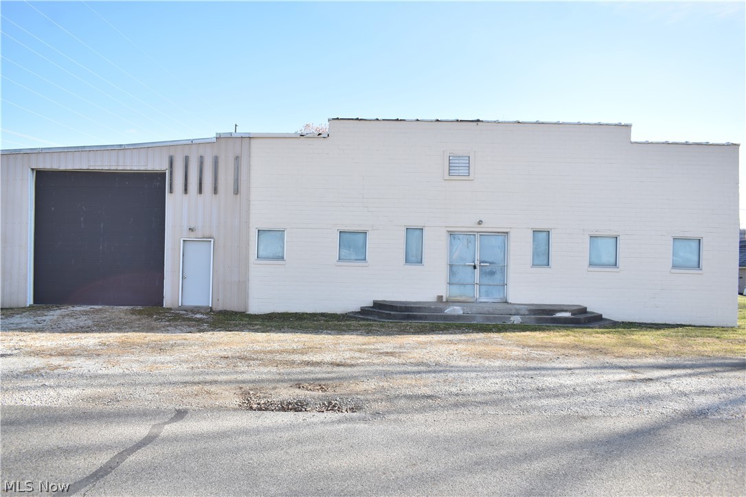 This would be a great industrial site for small manufacturer or for a large storage facility. The property was previously used a pottery manufacturer. The building features its own well and septic system, but could easily be connected into the city's water if so desired. Property features 4 parcels, 1 loading dock and 2 other overhead doors 14 x 12 and 16 x 14, 2 operational bathrooms, gas heat with A/C for part of the building. Space could be used for industrial, retail or warehouse. Building sits on over and 1/2 acre with plenty of room for parking or expansion.