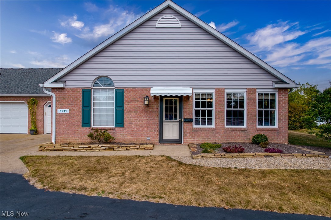Welcome to this charming one-floor, all-brick condo tucked in the desirable Village Commons development. A welcoming three-season room entry sets the tone for the bright, open layout inside. The living room boasts a vaulted ceiling and flows seamlessly into the dining area, creating the perfect space for both everyday living and entertaining. The spacious oak kitchen offers an abundance of cabinetry, a pantry, and plenty of prep space for home chefs. A convenient first-floor half bath with laundry adds to the home’s practicality. Two generously sized bedrooms share a well-appointed full bath, which features dual access from the hallway and the primary suite for added privacy. Additional highlights include a one-car attached garage with direct access to the basement, offering plenty of storage options, plus extra parking right out front. Enjoy a low-maintenance lifestyle with HOA coverage for landscaping, water, trash, and snow removal. Ideally located near downtown Hartville, you’ll love the easy access to shopping, restaurants, and parks. This home truly combines comfort, convenience, and carefree living—schedule your private showing today!