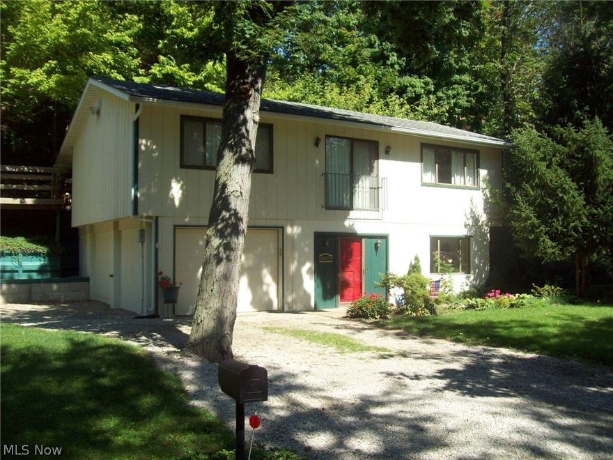 Wow a 2 story home with great river views and dock age for boats and water toys available across the street.This property and home are in fantastic condition all ready to move in to. Home updates include new Mahogany floor . new laminate flooring, decorative waterfall outside new sun room . The Sun room has vaulted plank ceilings, gas stove and leads to a wrap around deck.Property consists of 3 lots that provides a lot of privacy. Truly a great place to relax and is located in boater friendly area of nice homes. This is a fun house and a must to see. This property is also available with a 40 slip Marina and a Marine store as a package deal of $750,000