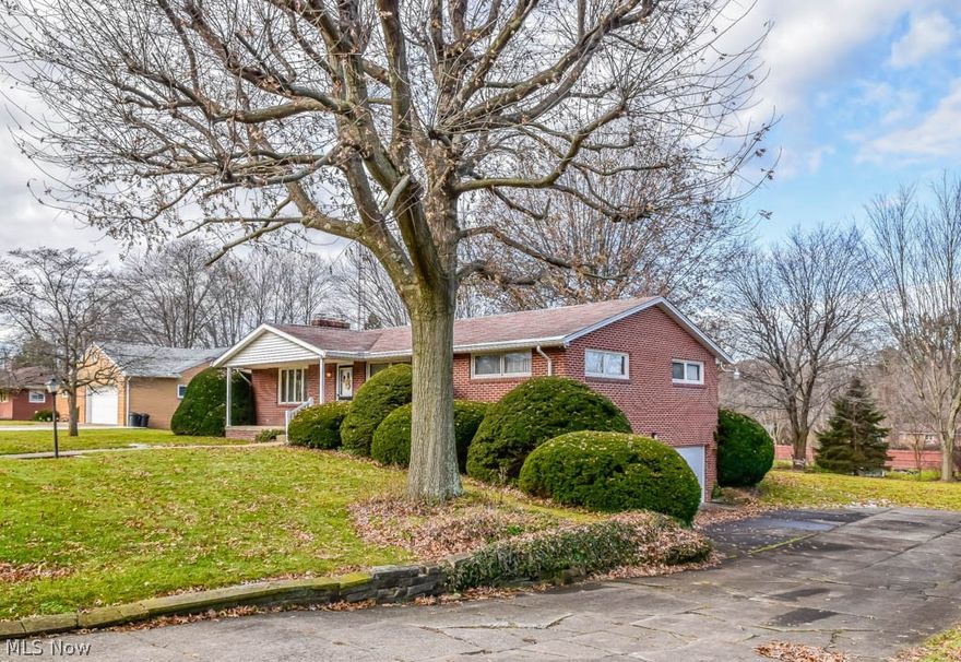 Well maintained 3 bedroom, 1.5 bath all-brick ranch on nearly an acre! Situated on 2 parcels with a huge side yard, a covered front porch and a back deck. Open kitchen and dining room! The kitchen includes a pantry, breakfast bar, oven and range. Enjoy quality time in the spacious, well-lit living room. Down the hall, all 3 bedrooms have hardwood floors. The master offers 2 closets plus built-in storage. The main full bath has dual sinks and a linen closet. Super deep hall closet for coats and overflow items. The full basement includes a storage room, a half bath and a huge rec room with glazed tile walls and a featured brick fireplace. Walkout access to the 2-car attached garage, also with glazed tile walls. Great Plain Township neighborhood! Come see all this home has to offer!