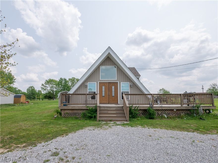Charming A-Frame home in Cinnamon Lake w/ Master (w/ walk-in closet) and Laundry on the Main Floor! Open concept kitchen and living area. Soft close cabinets/drawers and gorgeous granite countertops in the kitchen.  Upstairs you will find an additional bedroom and half bath! Beautiful view of the pond from the deck.