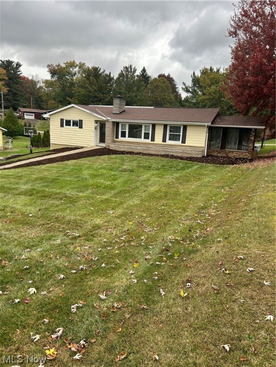 This Ranch home offers a large living room with a stone fireplace  that flows to the kitchen and the 3 season room, 3 bedrooms and 2 baths ,  a finished lower level family room with a fireplace, 2 car garage and a large concrete driveway, hot tub