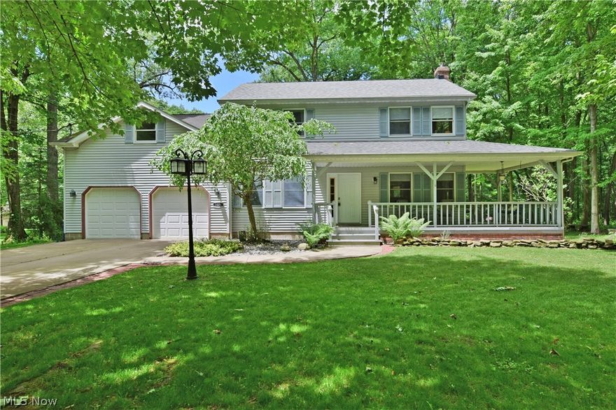 Lose yourself in the quiet, natural serenity of this scenic Howland Township residence, set deeply into a wooded lot! The tree lined home boasts wrapping front and rear lounge areas with a covered front patio and a huge deck that looks out over the grassy backyard. Step inside to enjoy a grand foyer with prominent central staircase that leads to the upstairs bedrooms. A mix of lavish tile and warm hardwoods fill the main floor and out into the window lined living room. Here, a brick fireplace joins a picturesque bay window before entering the kitchen. The stunning kitchen bridges both formal dining and an unbelievable finished family room with overheads skylights and breathtaking views. The kitchen offers ample cabinet and counter space and comes with newer stainless steel appliances. The cozy formal dining room offers beautiful hardwood flooring. An updated 2016 half bath joins laundry with washer & dryer staying and home office space or 1st floor bedroom to complete the floor. Upstai