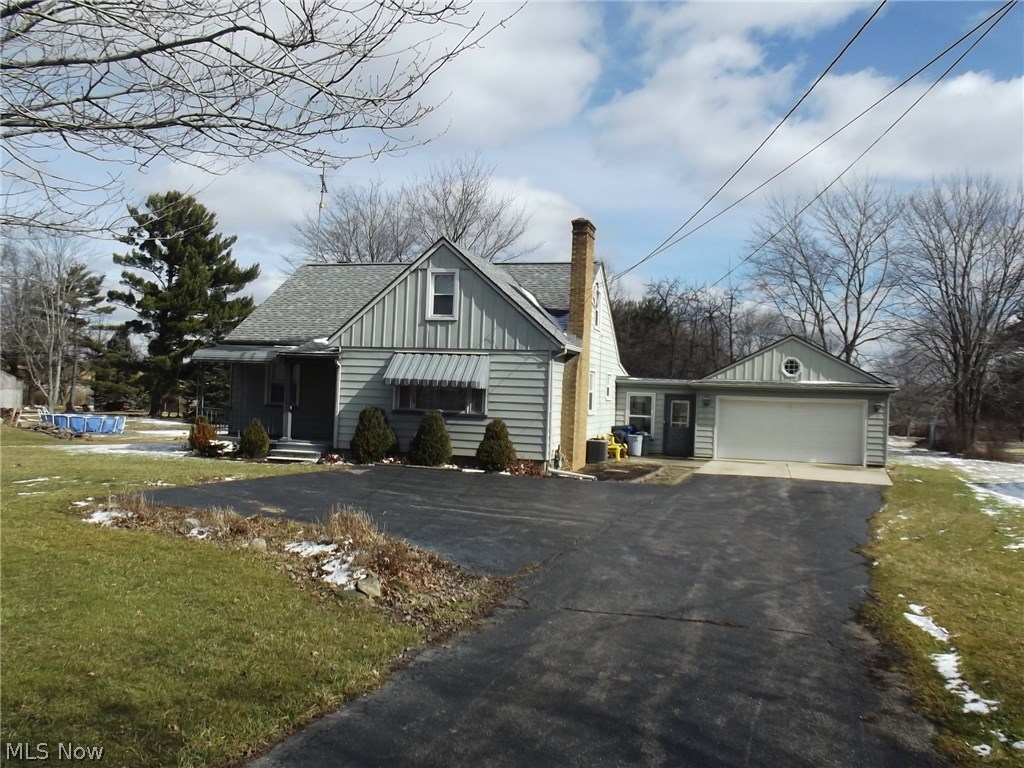 Enjoy a little bit of country but be close to city conveniences. Charming cape cod features 4 bedrooms, 1.5 baths, living room w/woodburning fireplace, updated oak kitchen & a 4 car garage situated on 1.32 acres. The major items have all been updated; furnace & central air 2014, roof 2003 & 200AMP breaker box 2010. beautiful hardwood floors in all the bedrooms. Spacious Florida room w/gas heater. Glass block windows in basement. Many fruit trees on the property. Auditor's site does not reflect the upstairs bedrooms as square footage. Great buy in Howland!