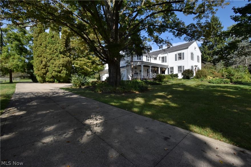 Amazing opportunity to own a truly one of a kind 5 bedroom, 4 acre century home/property, located in Chardon Schools. A truly unique blend of traditional century home charm, mixed with the luxury of modern living. Enjoy the chef’s kitchen with top of the line stainless steel appliance. Gas Wolf cook top, granite counters, large kitchen island, cherry kitchen cabinets, travertine backsplash, and  walk in pantry. Kitchen opens up to the large dining room where french doors lead you to the back covered porch. Experience your personal oasis on the brick paver patio, in-ground swimming pool, and pergola. The well landscaped property includes a barn, garden area, apple trees, pear trees, and walnut trees. Peace of mind with updated furnace (2023) roof (2023) air conditioner (2025) electric water heater (2019) *agent owned property