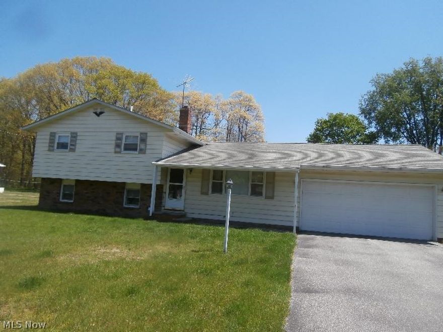 Short Sale-Subject to Bank Approval.  Opportunity abounds!  3 Bdrm 1.5 Bath 1954 Sq Ft Sided Split Level on 1/2 Acre Lot with 2 Car Attached Garage, Living Rm, Formal Dining Area, Large Eat in Kitchen, Enclosed (Unheated) Porch, Family Rm in Lower Level, hardwood flooring, shed and more!  House is dated and needs updating, but what an opportunity!