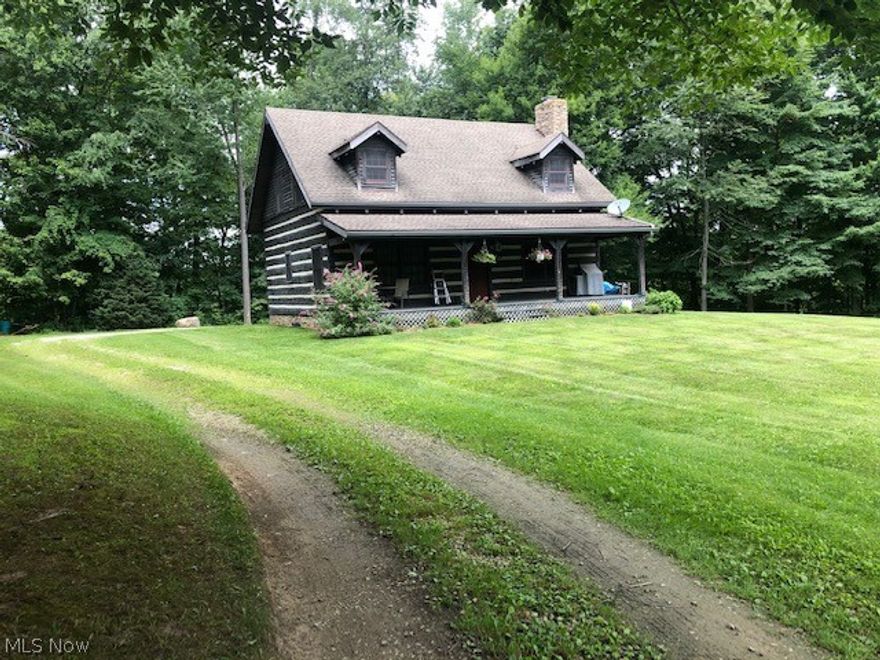Secluded log home on 1.6 acres.   Open great room, first floor master and laundry, vaulted ceilings, wood floors, exposed beams, wood burning fireplace and an abundance of natural light.  Second story was built to according to plans including Plumbing for second full bath.  Two additional bedrooms can be easily added should your buyer choose to do so.