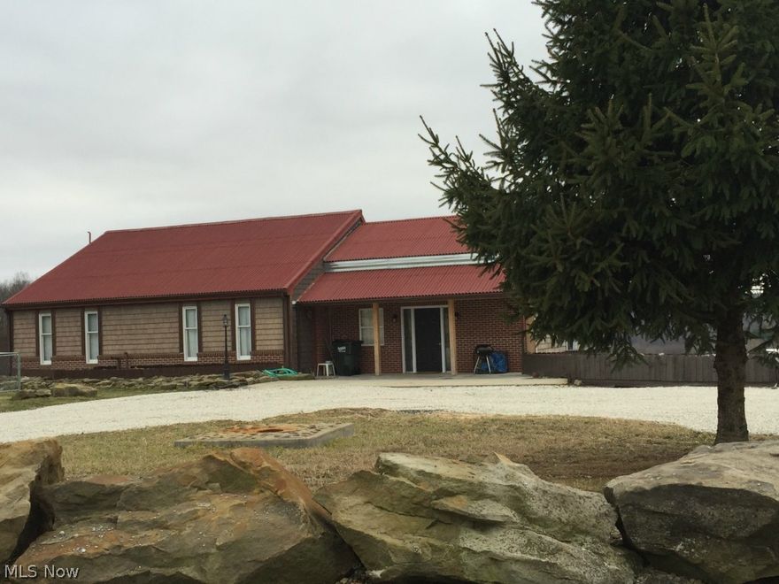 Mineral rights will transfer to the New Owners of this Home!   2.52 Acres of some of the best views in Carroll County!  This two bedroom, very Unique, Saltbox style creation could be yours.  The builder put many tedious hours planning and building this home to meld different styles and themes of areas he had been to.  There is an eclectic mix of finishes, textures and materials used throughout the home to create a truly stunning one of a kind piece of artwork that you could call Home.  This is a must see to appreciate house that the pictures just can not capture for you.  The sunken Living Room and Kitchen with 13 foot Ceilings and full wall Stone Gas Fireplace Will be a feast for the eyes!  Everywhere you turn will be an architectural feature that will stand out and blend with the next intriguing spot you see.  Outside you will find Never Ending Patios and Decks, one connecting to another on three sides of the home to extend your outdoor living experience.  The views of the valley bel