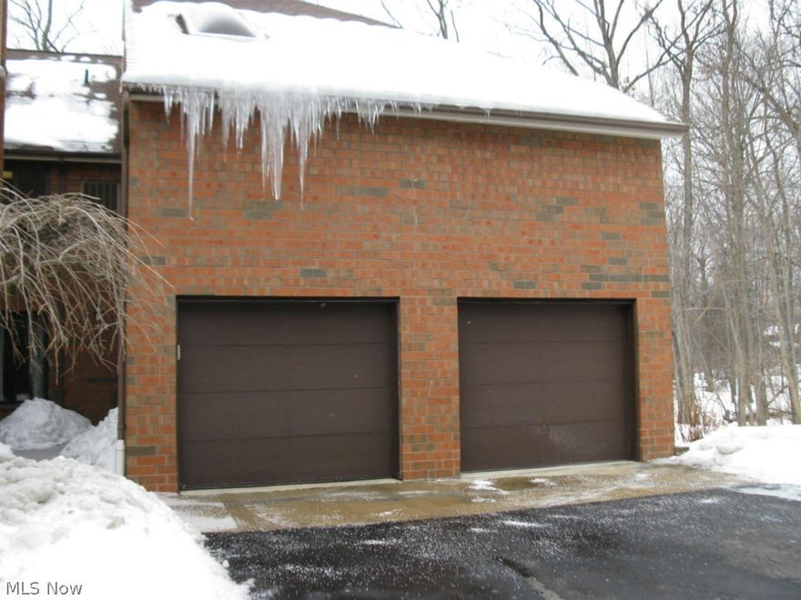 Beautiful end unit with gorgeous views of stream and woods. Over sized with a 2 car garage and your choice of 2 master bedrooms or use one for family room. Main floor family room has custom built in wall of cabinets that have 2 hide away beds, entertainment unit and bar . So many ways to use the space in this contemporary, loft with new sky lights and windows.