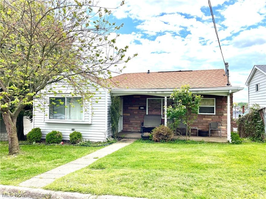 Ready and waiting! A modern-style ranch home with an open-concept living area, a newer AC unit, an updated kitchen, and updated bathrooms.  The lower level offers a nice size picture window view of the fenced-in backyard from a recreation/family room area.  The attached garage with garage door opener and alley access allows for easy parking and entry to the home.  Neutral tones throughout the home make this charming ranch move-in ready!