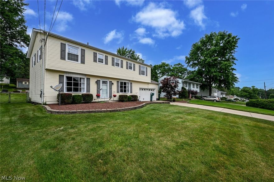 Welcome home to 9408 Fairfield Drive conveniently located in the city of Twinsburg. This home is not your everyday colonial! Inside this 2,220 Sq ft colonial you will find a touch of elegance and warmth. The first floor features an oversized kitchen that was recently remodeled. The large kitchen features a center island, newer cabinets, wood floors, and an eat-in kitchen. The kitchen’s open space offers plenty of room for seating space and versatility. Off the kitchen you will find a half bath to accommodate guests. Also adjacent to the kitchen are the dining room and living room that offer plenty of natural lighting.  On the 2nd floor you will find a spacious master bedroom with a nice sized walk-in closet and a sitting area to relax in. The master bath was recently refreshed, featuring a newer shower, vanity, and flooring. 3 more generously sized bedrooms with spacious closets and another full bath completes the 2nd floor.  The finished rec room in the basement gives you additional living space. The large 2 car attached garage offers additional storage above. The well-manicured landscaping and large back yard makes this the perfect home. For extended gatherings or needed relaxation, you will be able to enjoy the covered patio where you will find a heated hot tub and an area to entertain. You will enjoy getting cozy around the dedicated fire pit area with unlimited entertainment possibilities. The tucked away shed is ideal for yard tools, lawn furniture, and outdoor sporting equipment. The Point of Sale has been ordered and has been cleared. To give even more peace of mind, a home warranty has been included! Conveniently located near I-480, I-271, I-80.  Just a short distance away from the Twinsburg Fitness Center and Water Park, public library, schools, parks, shopping, restaurants, and so many other local attractions. Come take a look and call this one home!