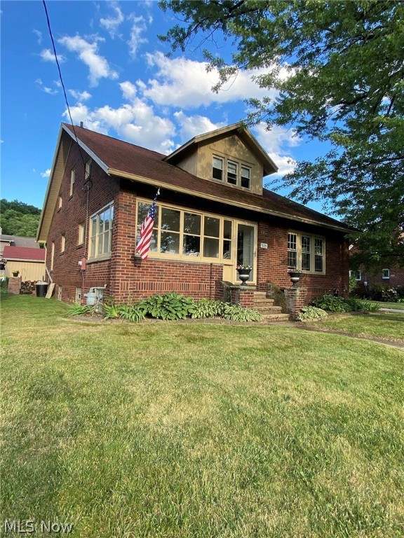 Charming Colonial Brick Home in Minerva! This home offers a fully remodeled 2015 eat-in kitchen with granite countertops, oak cabinets, lovely lighting fixtures, wood floors and newer LG appliances, and a mud room that could potentially be used as a first-floor laundry space or pantry area. Lots of space for entertaining in the large dining area that opens into another large living room with a gas fireplace. As if 1 Florida sunroom wasn't enough this home is split to offer a more relaxing bar room and a sunny seasonal room. The first-floor bedroom can also be used as an office area. 3 large bedrooms on the second level all have walk-in closet space. The upstairs also offers 2 additional rooms that can be used as playrooms, storage, or walk-in closets. Both full baths have been remodeled. The full basement has room for finishing and recreational purposes, it also offers a greenhouse and workshop. Lots of built-in storage space. New ceiling fixtures, fresh paint, hot water heater (2015),