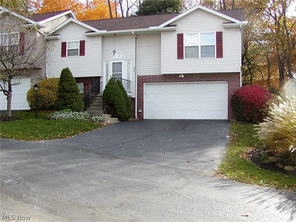 HOA $225 PER MONTH. Desirable, well maintained end unit with sliding glass doors from Great Room to deck overlooking private back yard. Vaulted ceiling in Great Room. Lower level glass doors from recreation room to patio. 2 1/2 baths. Newer appliances in kitchen with breakfast bar. Trane furnace-2010, Hot water tank--2013. Unit has newer roof. Double wide paved drive plus extra parking for visitors close by the unit. America's Preferred Home Warranty included.