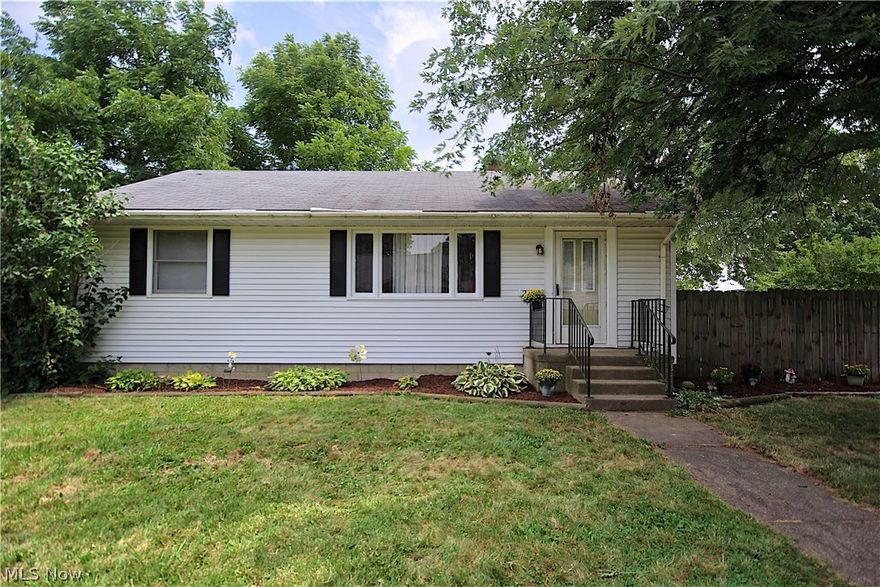 Centrally located Ranch in Perry Local Schools. Updates include recently painted interior walls on the main level, an updated bathroom (2014) and newer laminate flooring in the living room, kitchen, and hallway (2015). Additional updates completed include the privacy fence, driveway widening with gravel surface, a newer patio, and 12 x 28 "Old Hickory Building" which was formerly used for boat storage but is large enough for a small car. The main floor includes a living room with a small dining area, kitchen, full, updated bathroom, and, 3 bedrooms. The basement includes a partially finished recreation room and two additional rooms for storage. For those seeking the convenience of a first floor laundry, the northeast bedroom is equipped with washer/dryer connections and is used as a combination laundry/bedroom by the owners. The large patio is private and allows for outdoor entertaining in the warmer months. Conveniently located between Massillon and Canton just off the Lincoln way/Wes