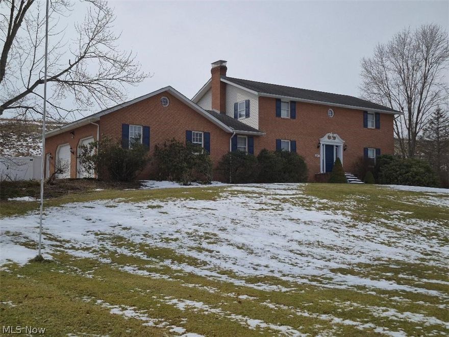 This serene Amish built, all brick 2-story is located on 1.96 acres with a pool and a private fenced in back yard. This beautiful home has 3 bedrooms upstairs with a fourth bedroom/office on the first floor. The kitchen comes with all appliances, oak raised panel cabinet doors, and pull out shelves in base cabinets, a 3 x 5 center island, pantry and a desk area with under cabinet lighting. Two appliance garages are included. Crown mold is included with a dinette area with windows looking outwards to the pool. The formal dinning room has crown mold and is right off the kitchen. The foyer is oak parquet flooring with an oak stairway leading to the 2 floor. The great room is L-shaped with crown mold and a fire box (the box is not connected to the chimney). First floor laundry room with washer and dryer, coat closet and a full bathroom with a 3-0 shower, close to the garage. The 2'a floor has a main bathroom and master bathroom. 2 bedrooms with his/hers closets and crown mold. The master bedroom is huge with crown mold and a L-shaped walk-in closet. The front side of the basement is finished (644 sq ft est.) with a full bathroom. Room for parties or a pool table, crown mold, can lights and a fire box that works. The utility room on the back side has easy access to the garage and contains the electrical box, furnace, water heater and soft water system. Two unfinished rooms can be used as a workshop. A vacuflo system with hoses and a security system is included. The 4 car (48 x 30) garage pole building with 4 garage doors (1997) and a (36 x 18) heated pool was install in (1986). A gas grill and electric hot tub is located on a brick patio. The existing underground gas line will be disconnected to the house and the Buyer shall need to convert to either geothermal, electric or propane. All mineral rights. Swimming pool has a deep end. Seller will make concessions on having the furnace and water heater change to electric or propane.