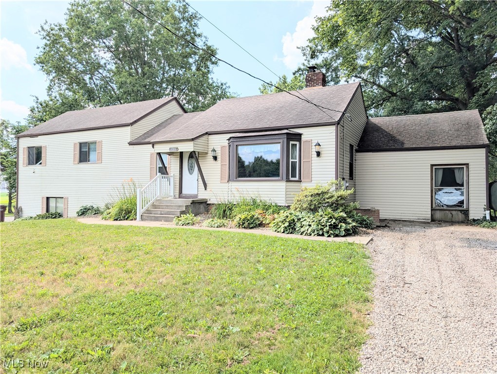 Discover the charm of country living with the convenience of modern updates in this beautifully unique home nestled on nearly 2 acres of peaceful land. Thoughtfully designed with an open and inviting floor plan, this home offers both functionality and character in a serene setting. Step inside to find a spacious, fully applianced kitchen featuring granite countertops, abundant cabinet space, and a seamless flow to the outdoors. Sliding glass doors lead directly to the expansive backyard, making it perfect for entertaining, summer grilling, or simply enjoying the open air and natural surroundings. The kitchen opens into a warm and welcoming great room, highlighted by a cozy fireplace and large windows that bring in natural light and views of the property. It’s the perfect gathering spot for family and friends or a quiet evening in. Upstairs, you'll find four generously sized bedrooms, including a stunning master suite that offers a peaceful retreat. The master bedroom features its own private deck — ideal for sipping your morning coffee or winding down at the end of the day while taking in the quiet beauty of the countryside. One of the standout features of this property is the massive garage, perfect for car enthusiasts, hobbyists, or anyone in need of serious storage. Whether you're looking to store vehicles, boats, recreational equipment, or set up a workshop, this space offers the room and flexibility to do it all — and still have space left over. Outside, the nearly 2-acre lot provides endless opportunities for gardening, recreation, or just relaxing and embracing the space and privacy that come with country living. Whether you're looking to expand, settle down, or just get away from it all, this home offers the space, style, and setting to make it all possible. Don’t miss this rare opportunity to own a truly special home with land, charm, and modern comfort all in one!